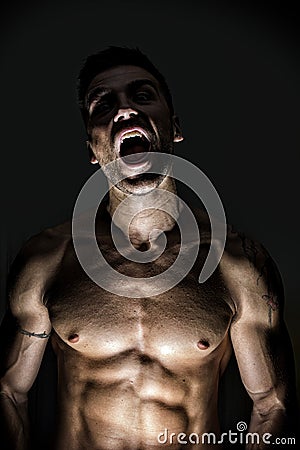 Illuminated Werewolf Man Opening His Mouth Stock Photo