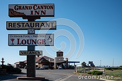 Illuminated sign during the day announcing hotels and restaurants near the Grand Canyon Editorial Stock Photo