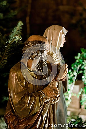 Illuminated Statue of a Biblical Scene Featuring Joseph and Mary Stock Photo