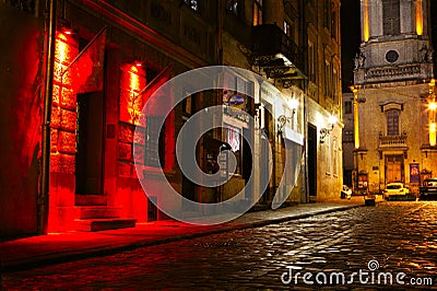 Illuminated street at night Stock Photo