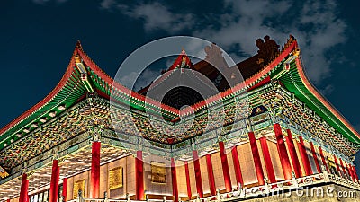 Illuminated traditional Asian building in an urban setting at night Stock Photo