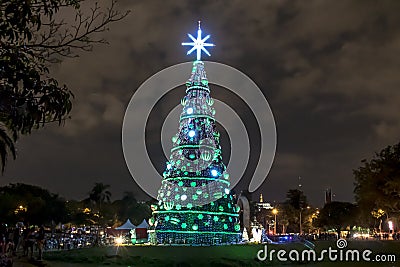 : Illuminated traditional Christmas tree in Ibirapuera, at night, it is of the attraction in the south zone of the city of Sao Pau Editorial Stock Photo