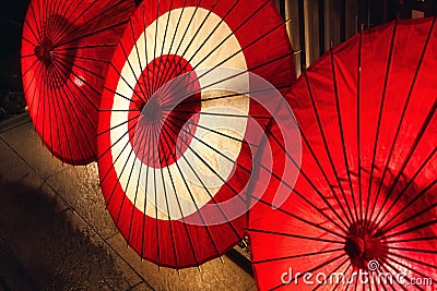 illuminated traditional red paper umbrellas in Kyoto, Japan Stock Photo