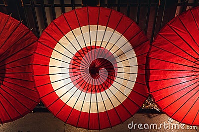 illuminated traditional red paper umbrellas in Kyoto, Japan Stock Photo