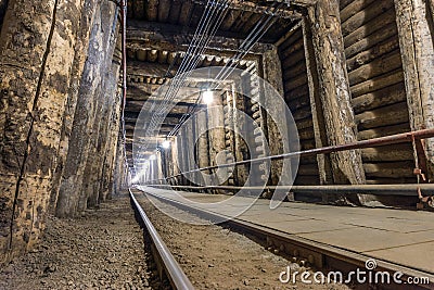 Illuminated underground tunnel in a mine Stock Photo