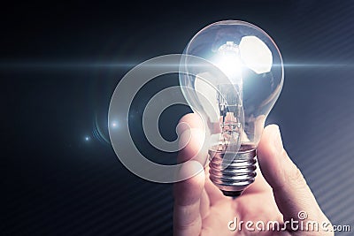 Illuminating bulb in mens hand. Future technology idea concept. Stock Photo