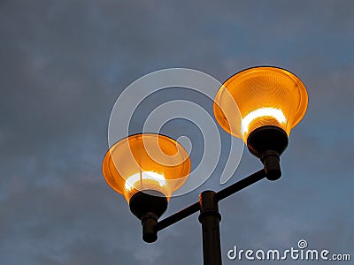 Illuminating pole against a stormy sky Stock Photo