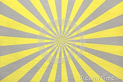 Illuminating Yellow and Ultimate grey retro starburst in alternating stripes - abstract pastel stone background Stock Photo