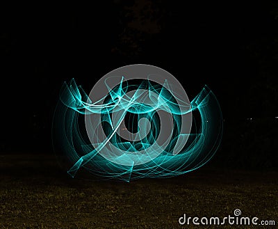 Illustrated blue abstract light painting on the background of a landscape Stock Photo
