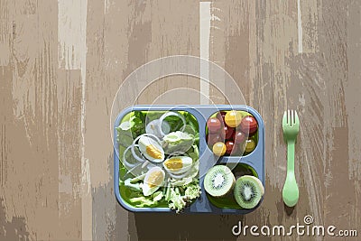 Lunch box with food on wooden table Stock Photo