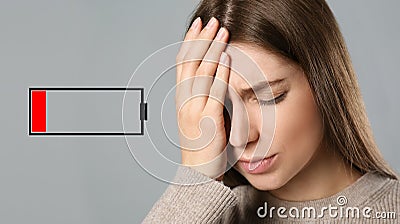 Illustration of discharged battery and tired woman on light grey background. Extreme fatigue Stock Photo