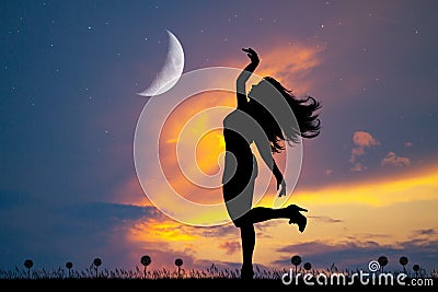 Little girl dancing in the moonlight and in the stars Stock Photo