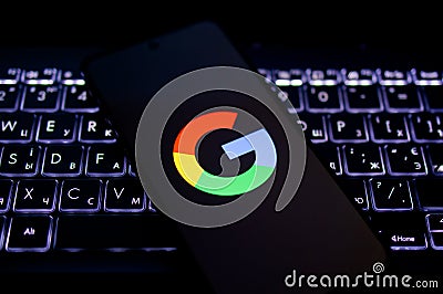 Illustration photo of close-up Google logo displayed on a screen of smartphone Editorial Stock Photo