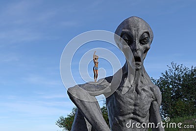 Illustration of a yawning alien with a tiny woman also yawning standing on the extraterrestrials arm Cartoon Illustration