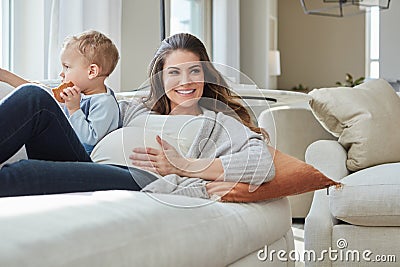 Im really excited about having baby number two. a pregnant woman bonding with her toddler son at home. Stock Photo