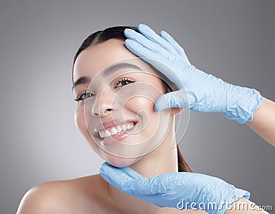 Im gonna look even more amazing. Studio portrait of an attractive young woman having some plastic surgery done against a Stock Photo