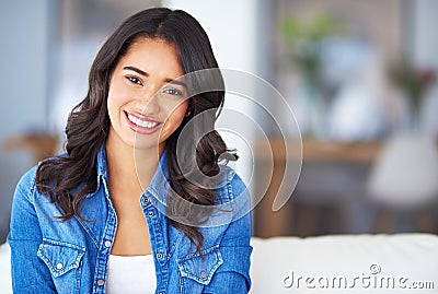 Im a homebody. a young woman relaxing at home on the weekend. Stock Photo