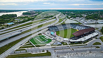 Aerial Lynn Family Stadium soccer field with criss crossing suspended highway roads distant river Editorial Stock Photo