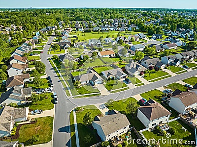 Aerial neighborhood on warm summer day with green lawns Stock Photo