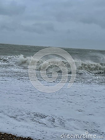 Waves slamming into a beach Stock Photo