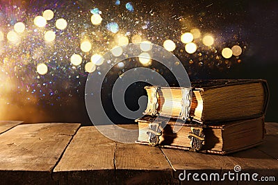 Image of antique books, with brass clasps on old wooden table Stock Photo