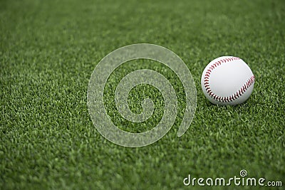 Baseball on grass Stock Photo