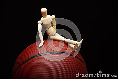 Image of basketball wooden figure dark background Stock Photo
