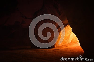 image of beautiful golden light through the cave entrance Stock Photo