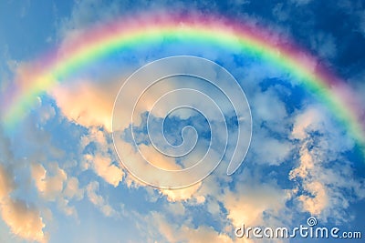 Rainbow in The Sky at Sunset Stock Photo