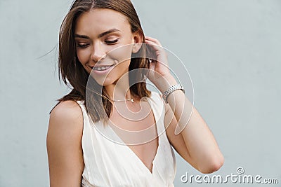 Smiling optimistic young woman posing Stock Photo