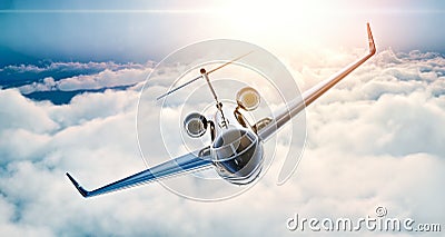 Image of black luxury generic design private jet flying in blue sky at sunset. Huge white clouds background. Business Stock Photo