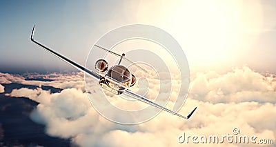 Image of black luxury generic design private jet flying in blue sky at sunset. Huge white clouds and sun background Stock Photo