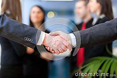 Image of business partners handshake on signing contract Stock Photo