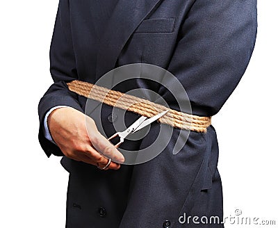 Image of businessman trying to get rid of fetters Stock Photo