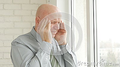 Businessperson Image Suffering a Big and Severe Headache Stock Photo