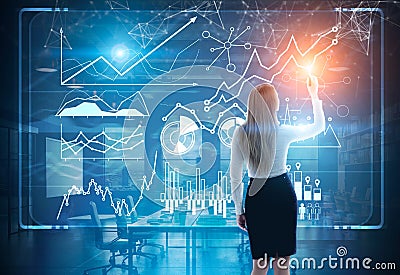 Image of businesswoman in grey suit drawing graph Stock Photo