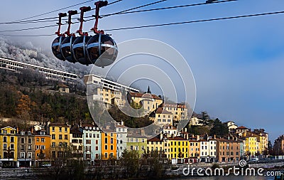 Image of cable cars in Grenoble in autumn over riverside Stock Photo