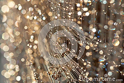 Abstract texture of fine fibers with delicate sparkling lights in a golden bokeh effect Stock Photo