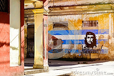 Image of Che Guevara and a cuban flag on an old building in Havana Editorial Stock Photo