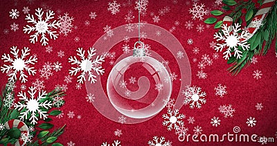 Image of christmas bauble dangling over snow falling on red background Stock Photo