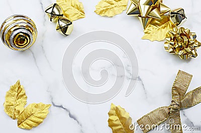 Image of a Christmas border on a marble taple top. Top view flat lay design with homemade cookies and golden gifts. Stock Photo