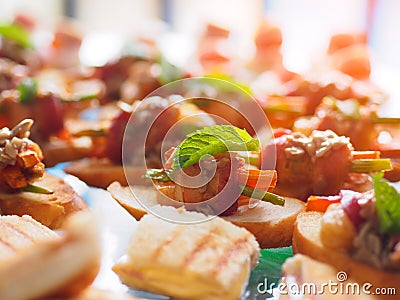 The image of Delicious canapes, bacon snacks and appetizing snacks set on the table Stock Photo