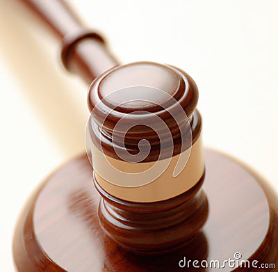 Image of close up of judge slamming gavel on white background Stock Photo