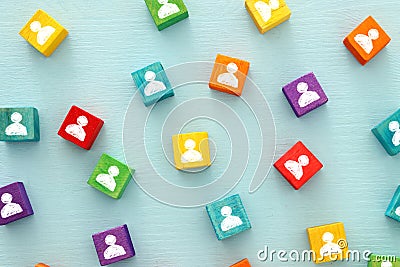 image of colorful blocks with people icons over wooden table ,human resources and management concept. Stock Photo