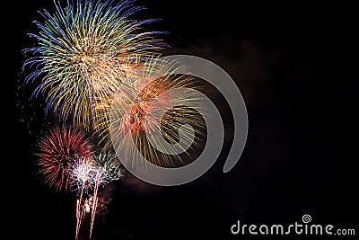 Fireworks Bursting in Night Sky with Copyspace Stock Photo