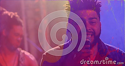 Image of colourful light swirls and spray paint over diverse male singer and musician performing Stock Photo