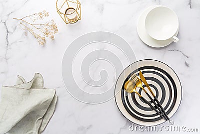 Image of cutlery sets with plate, cup and candle. Party theme, place and table setting Stock Photo