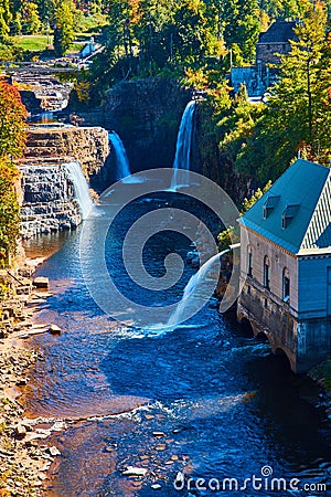 Detail of river canyon with multiple large waterfalls and Hydroelectric power plant Stock Photo