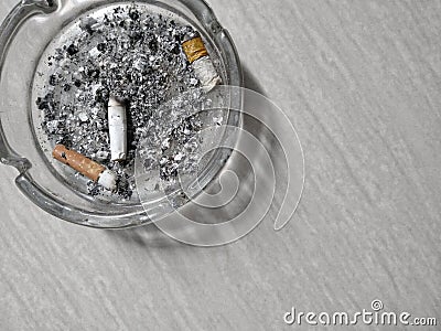 Image of a dirty ashtray because cigarette butts and ashes Stock Photo