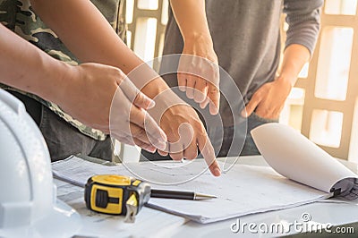 Image of engineer meeting for approved architectural project, working with partner and engineering tools on workplace Stock Photo